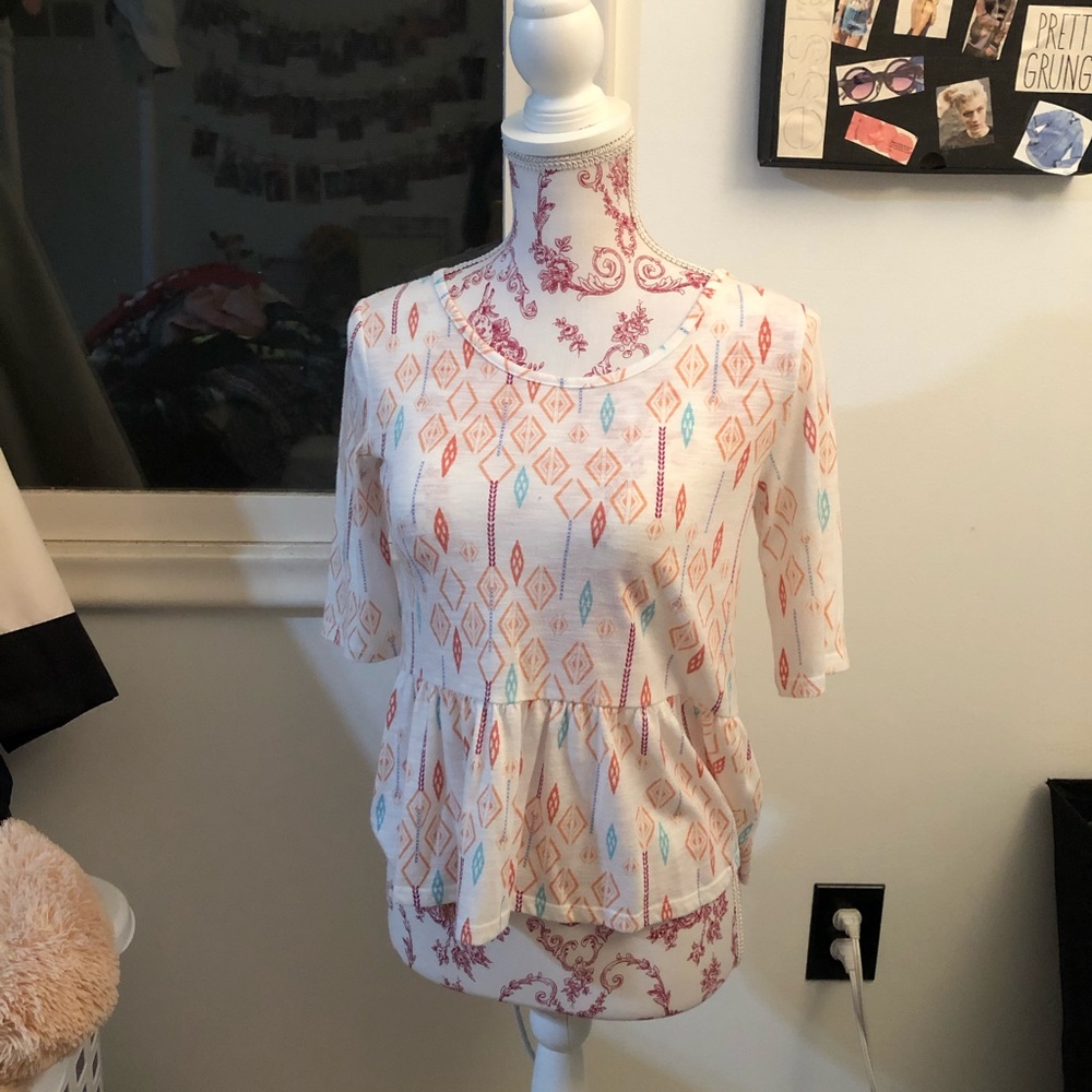 Tribal print peplum shirt